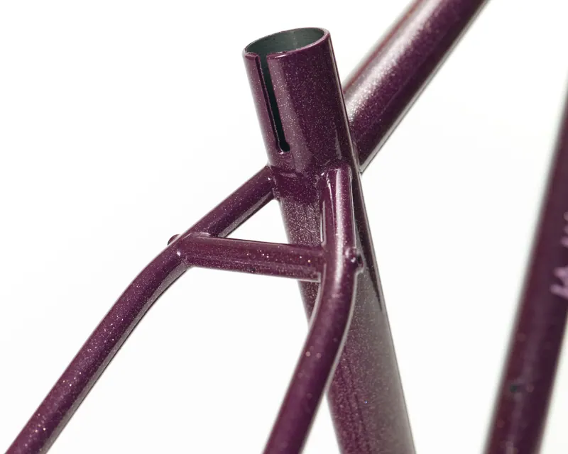 Plum sparkle powder coat on steel tubes, close up