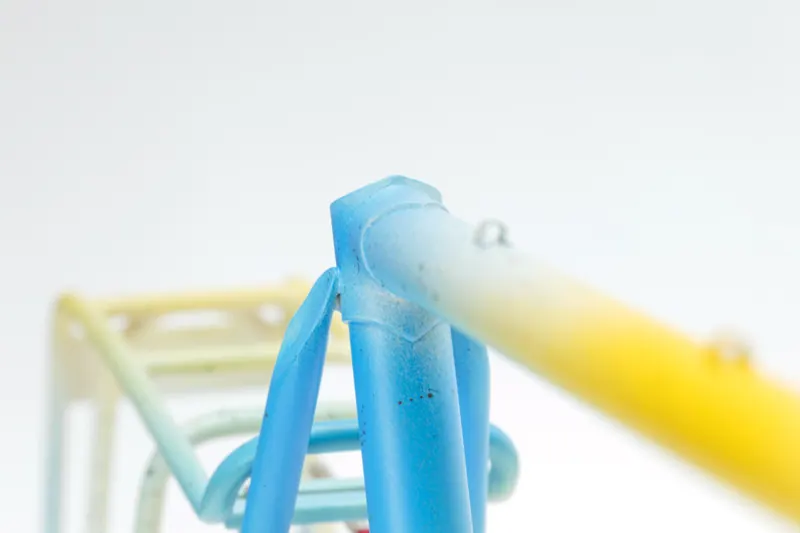 Close detail of a pastel fade across frame and rack