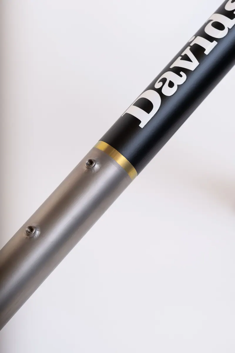Titanium frame with a black Cerakote panel and lettering