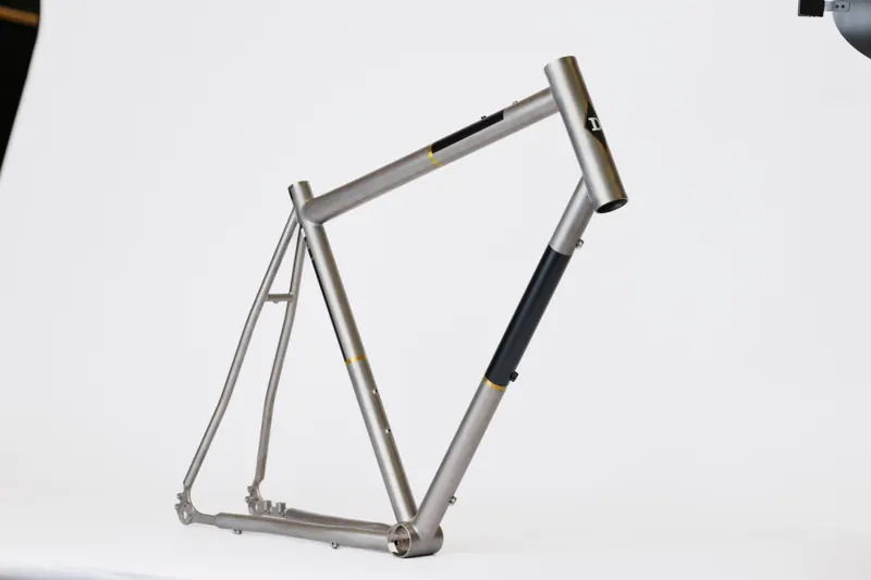 Raw titanium with a black panel.