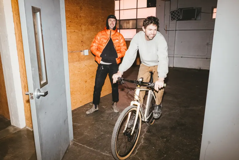 Someone riding a bike into the shop